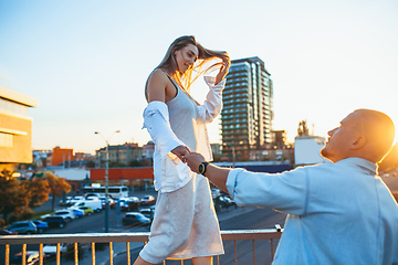 Image showing Tanned young caucasian couple, modern lovestory in film grain effect