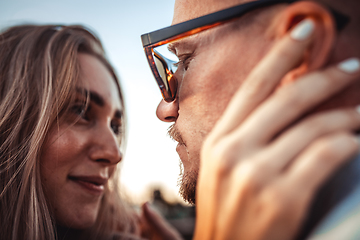 Image showing Tanned young caucasian couple, modern lovestory in film grain effect