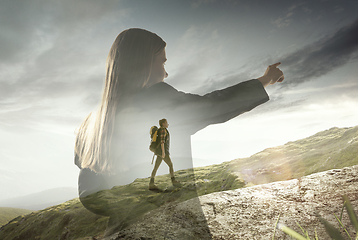 Image showing Silhouette of businesswoman with landscapes on background, double exposure.