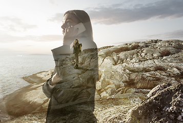 Image showing Silhouette of businesswoman with landscapes on background, double exposure.