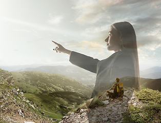 Image showing Silhouette of businesswoman with landscapes on background, double exposure.