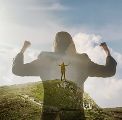 Image showing Silhouette of businesswoman with landscapes on background, double exposure.