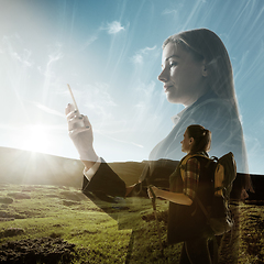 Image showing Silhouette of businesswoman with landscapes on background, double exposure.