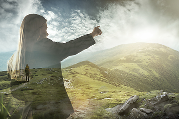 Image showing Silhouette of businesswoman with landscapes on background, double exposure.