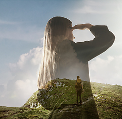 Image showing Silhouette of businesswoman with landscapes on background, double exposure.