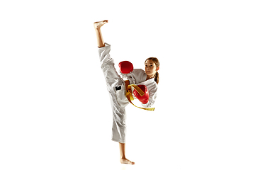 Image showing Confident junior in kimono practicing hand-to-hand combat, martial arts