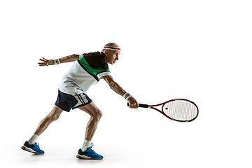 Image showing Senior man playing tennis in sportwear isolated on white background