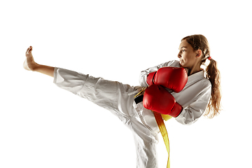 Image showing Confident junior in kimono practicing hand-to-hand combat, martial arts