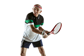 Image showing Senior man playing tennis in sportwear isolated on white background