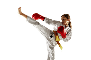 Image showing Confident junior in kimono practicing hand-to-hand combat, martial arts