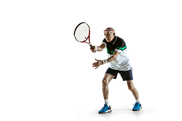 Image showing Senior man playing tennis in sportwear isolated on white background