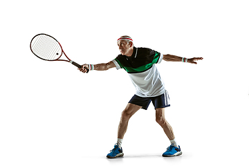 Image showing Senior man playing tennis in sportwear isolated on white background