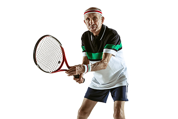 Image showing Senior man playing tennis in sportwear isolated on white background