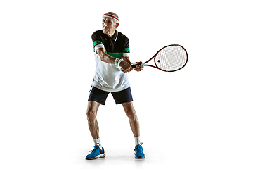 Image showing Senior man playing tennis in sportwear isolated on white background