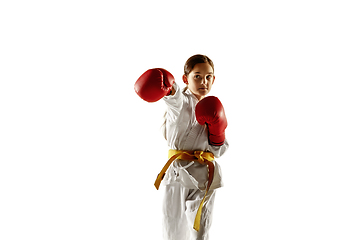 Image showing Confident junior in kimono practicing hand-to-hand combat, martial arts