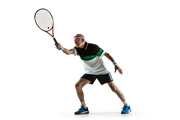 Image showing Senior man playing tennis in sportwear isolated on white background