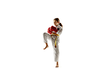 Image showing Confident junior in kimono practicing hand-to-hand combat, martial arts