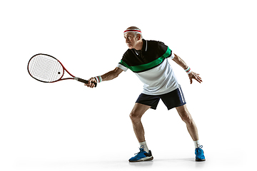 Image showing Senior man playing tennis in sportwear isolated on white background