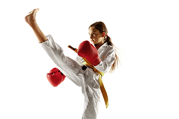 Image showing Confident junior in kimono practicing hand-to-hand combat, martial arts