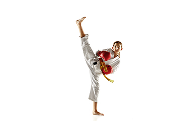 Image showing Confident junior in kimono practicing hand-to-hand combat, martial arts