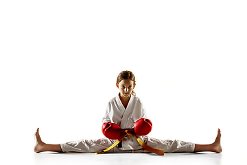 Image showing Confident junior in kimono practicing hand-to-hand combat, martial arts