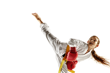 Image showing Confident junior in kimono practicing hand-to-hand combat, martial arts