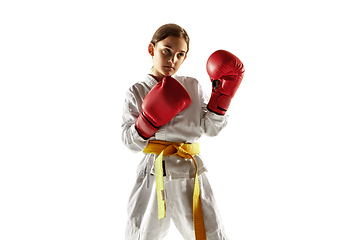 Image showing Confident junior in kimono practicing hand-to-hand combat, martial arts