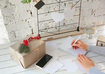 Image showing Writes wishes, dreams and goals, making plan for New Year and Christmas