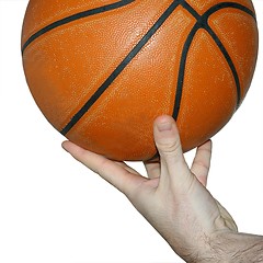 Image showing Hand holding a basketball