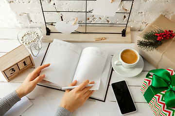 Image showing Writes wishes, dreams and goals, making plan for New Year and Christmas