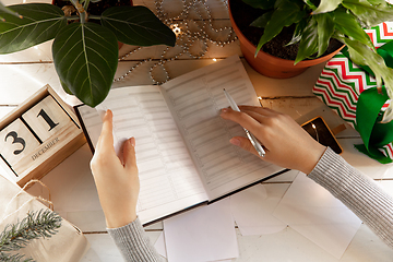 Image showing Writes wishes, dreams and goals, making plan for New Year and Christmas