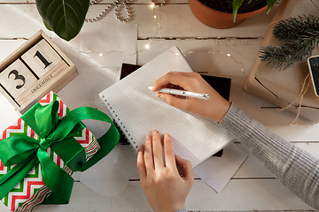 Image showing Writes wishes, dreams and goals, making plan for New Year and Christmas