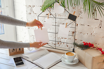 Image showing Writes wishes, dreams and goals, making plan for New Year and Christmas