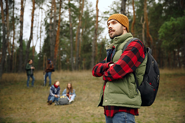 Image showing Group of friends on a camping or hiking trip in autumn day