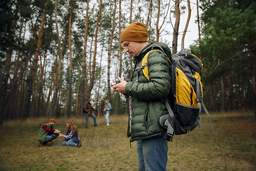 Image showing Group of friends on a camping or hiking trip in autumn day