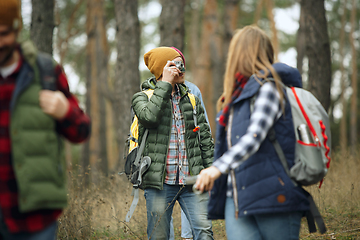 Image showing Group of friends on a camping or hiking trip in autumn day