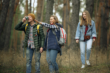 Image showing Group of friends on a camping or hiking trip in autumn day