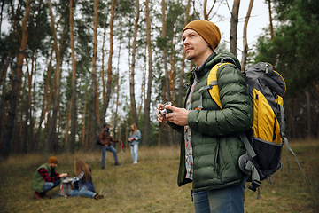 Image showing Group of friends on a camping or hiking trip in autumn day