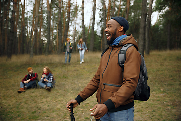 Image showing Group of friends on a camping or hiking trip in autumn day