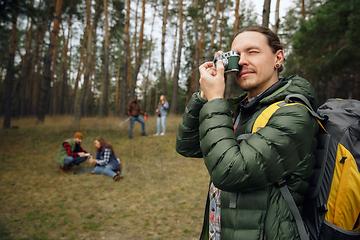 Image showing Group of friends on a camping or hiking trip in autumn day