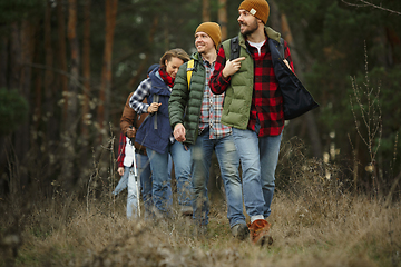 Image showing Group of friends on a camping or hiking trip in autumn day