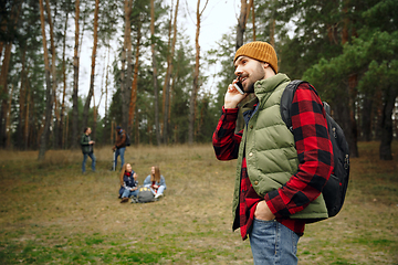 Image showing Group of friends on a camping or hiking trip in autumn day