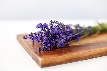 Image showing bunch of lavender flowers on wooden board