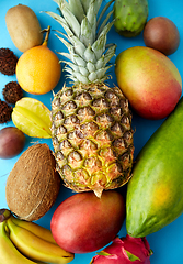 Image showing many different exotic fruits on blue background