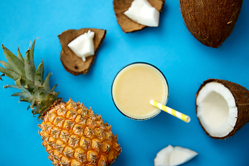 Image showing pineapple, coconut and drink with paper straw