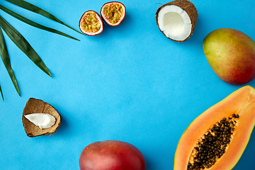 Image showing different exotic fruits on blue background