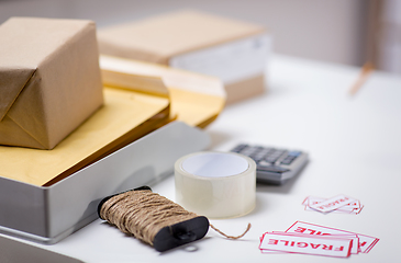 Image showing parcel boxes and packing stuff at post office