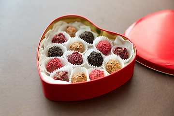 Image showing candies in red heart shaped chocolate box