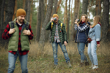 Image showing Group of friends on a camping or hiking trip in autumn day