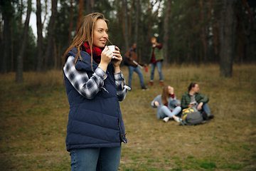 Image showing Group of friends on a camping or hiking trip in autumn day